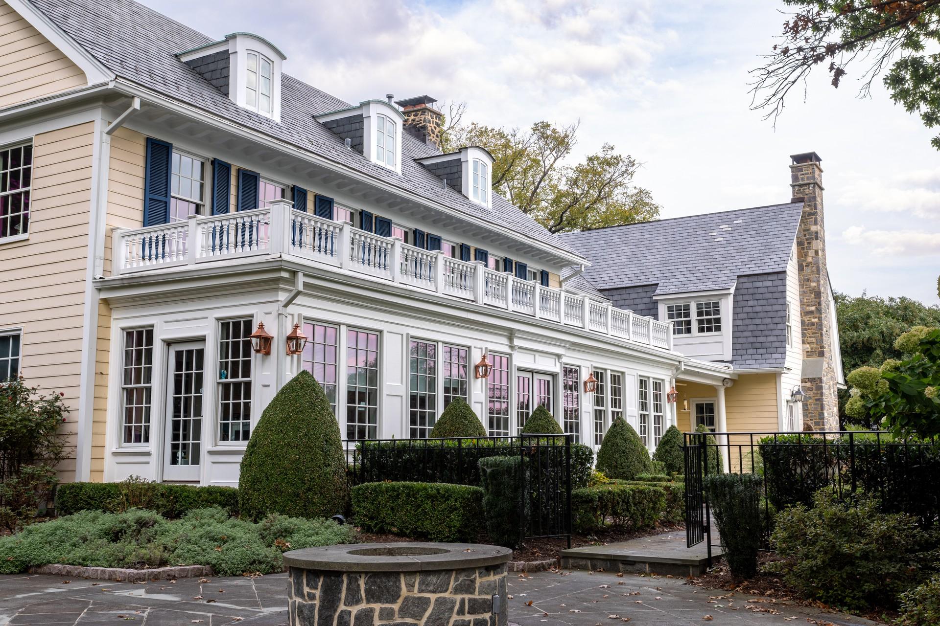 North Wind project in Ruxton, Maryland — angled view of the home and stone terrace by Samuel Adams & Company (photo: Austin Green)