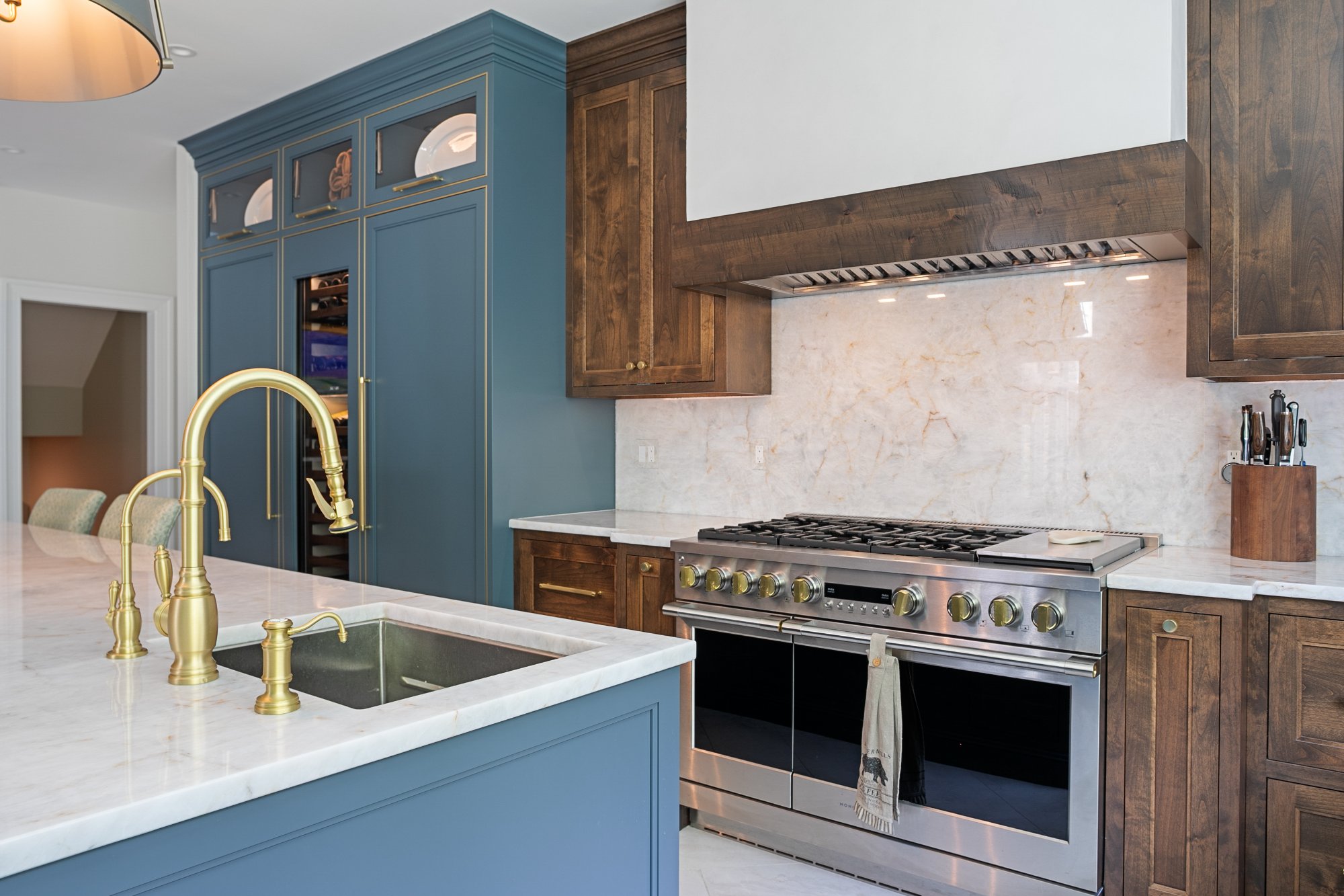 Island sink and pro range with walnut hood surround — Monkton Farms