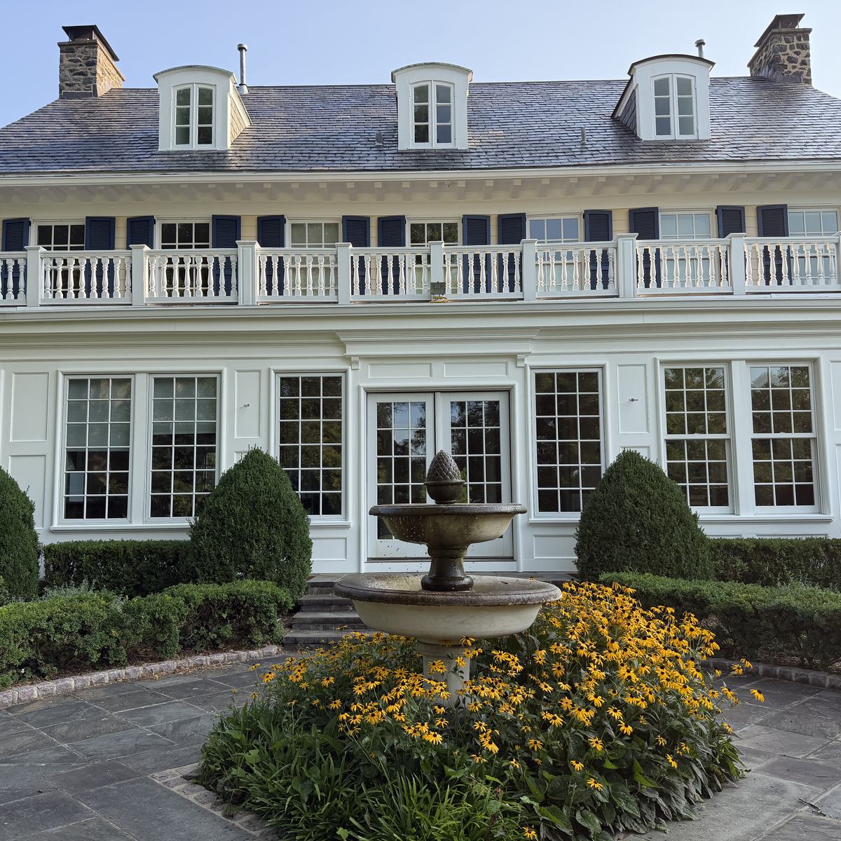 Restored porch in linseed oil paint with formal garden — North Winds Porch, Towson