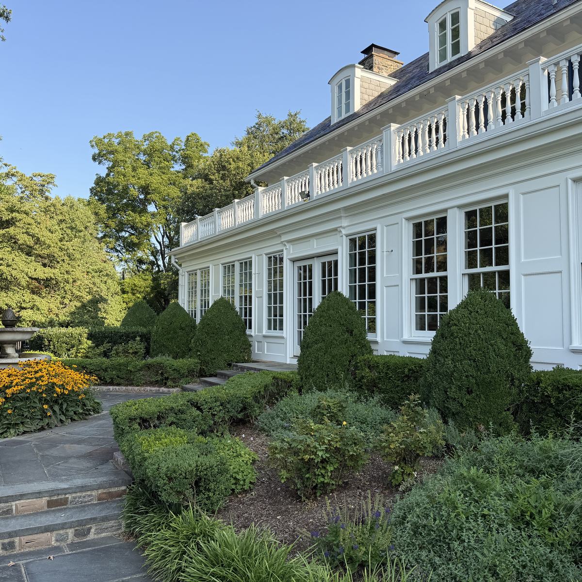 Garden elevation of the completed porch with paneled pilasters and original balustrade above — North Winds Porch, Towson