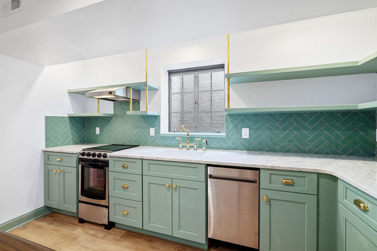 Overhead Carrara marble countertop with brass bridge faucet — Butler, MD