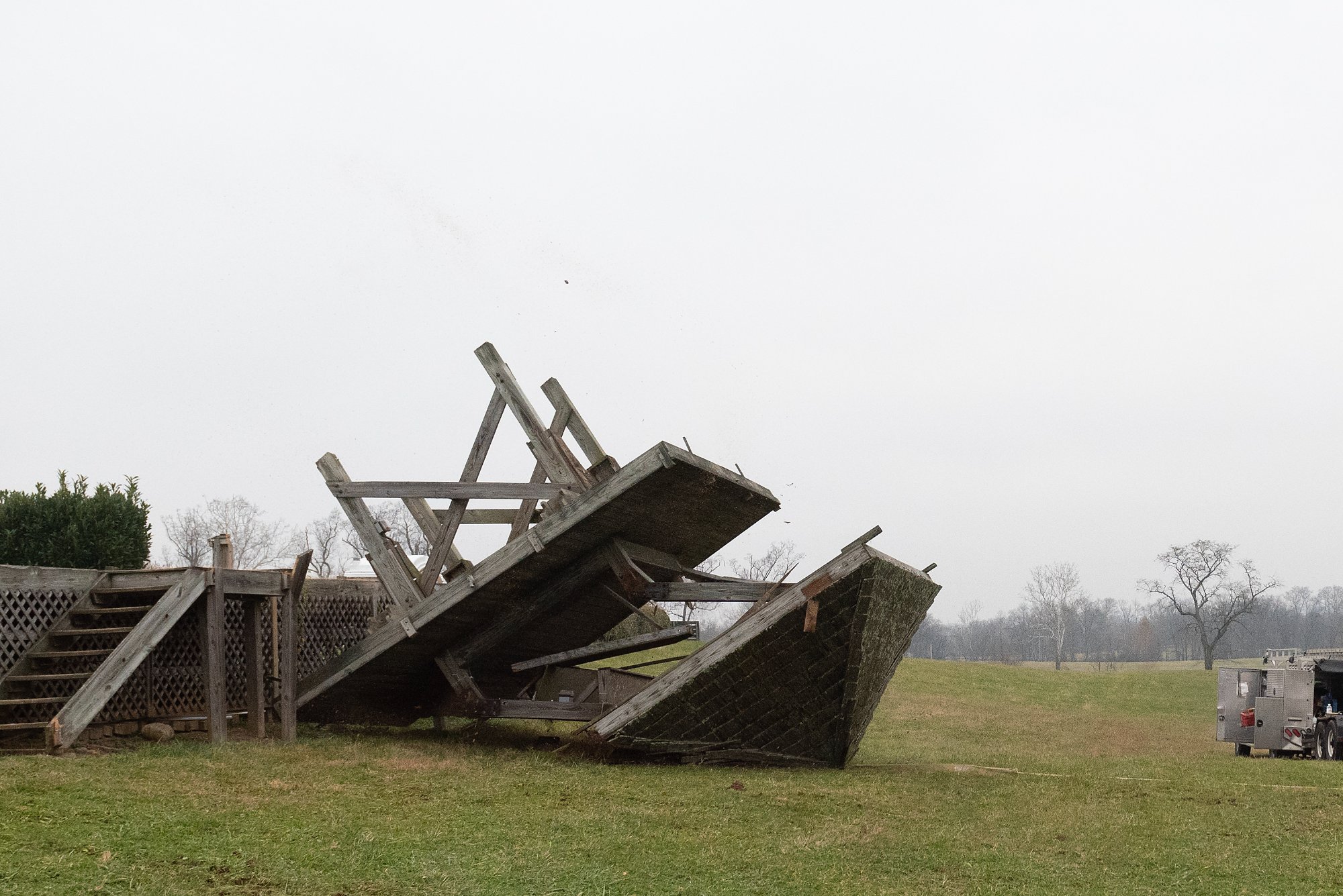 Tower fully collapsed on the ground, roof and frame separated — Shawan Downs demolition complete