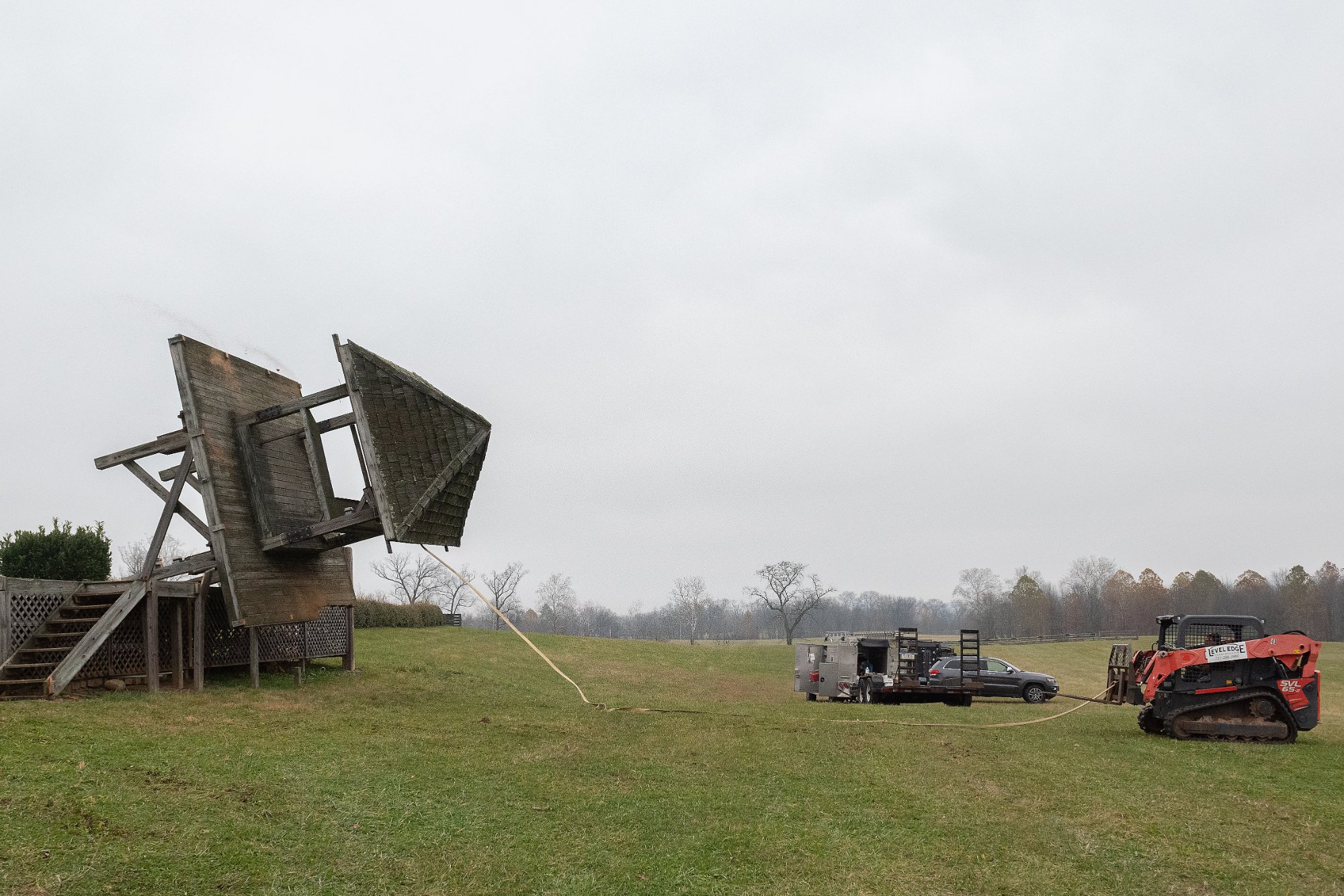 Tower mid-collapse as roof separates from frame during controlled demolition — Shawan Downs