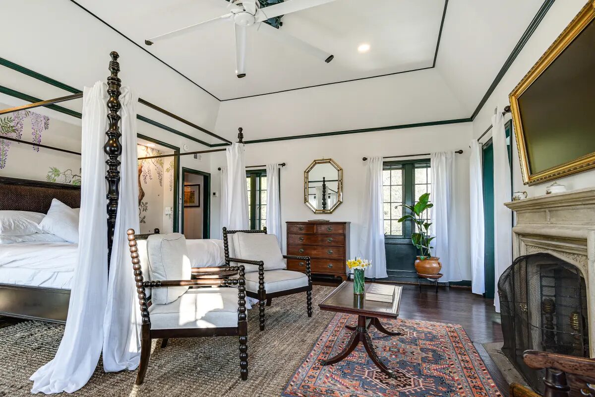 Clawfoot tub with chandelier and floor-to-ceiling marble slab walls — Hunt Valley